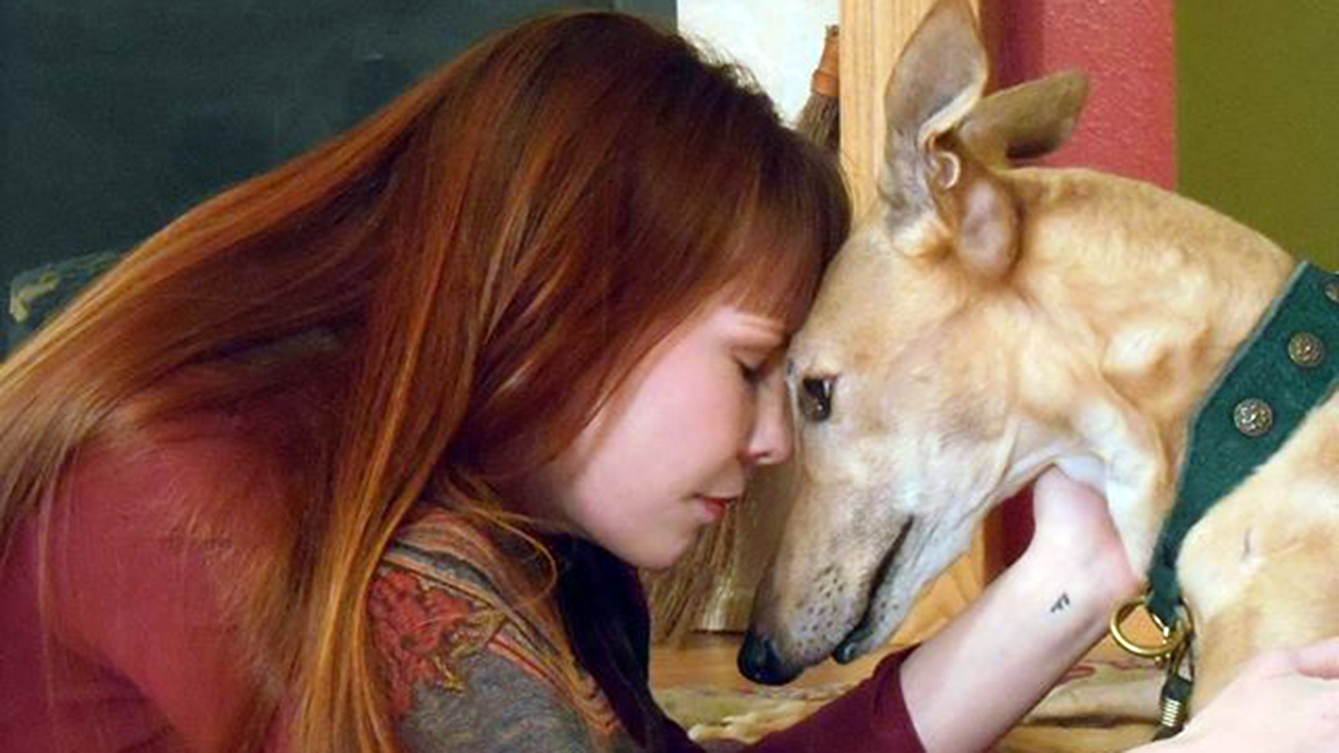 Woman sharing a loving moment with her dog, showing the bond and compassion offered by Peace for Paws in Las Vegas